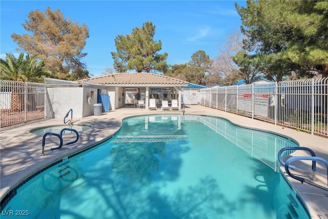 pool with fence and a patio area