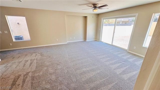 unfurnished room with carpet, baseboards, and ceiling fan