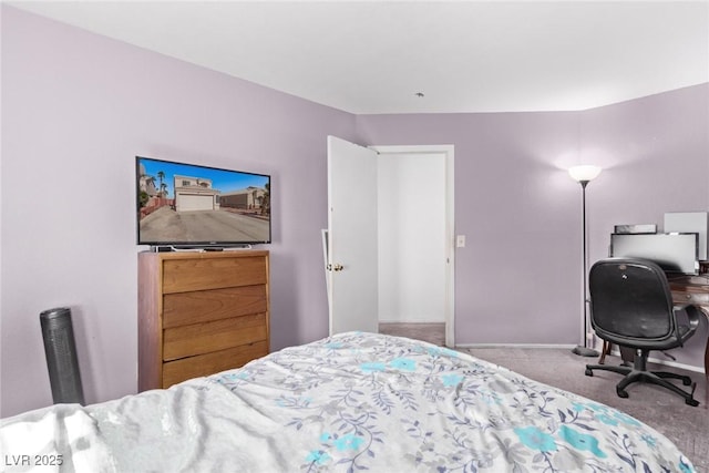 bedroom with carpet and baseboards