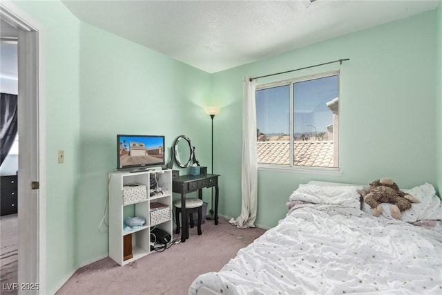 carpeted bedroom with baseboards