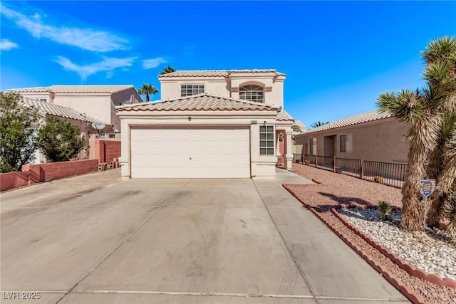 mediterranean / spanish home featuring driveway, a tiled roof, an attached garage, fence, and stucco siding