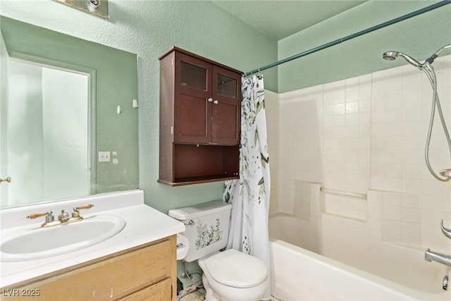 full bathroom with shower / bath combination with curtain, a textured wall, vanity, and toilet