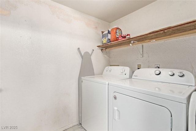 clothes washing area with laundry area and washer and clothes dryer