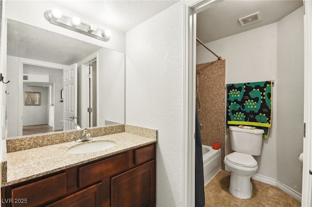 bathroom with visible vents, toilet, bathtub / shower combination, a textured ceiling, and vanity