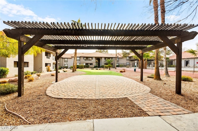 view of home's community with a residential view and a pergola