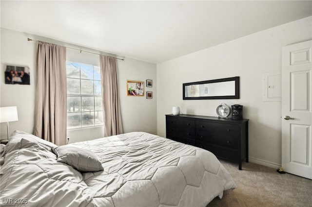 bedroom with light carpet and baseboards