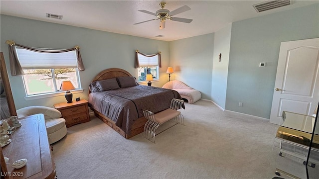 carpeted bedroom featuring visible vents, ceiling fan, and baseboards