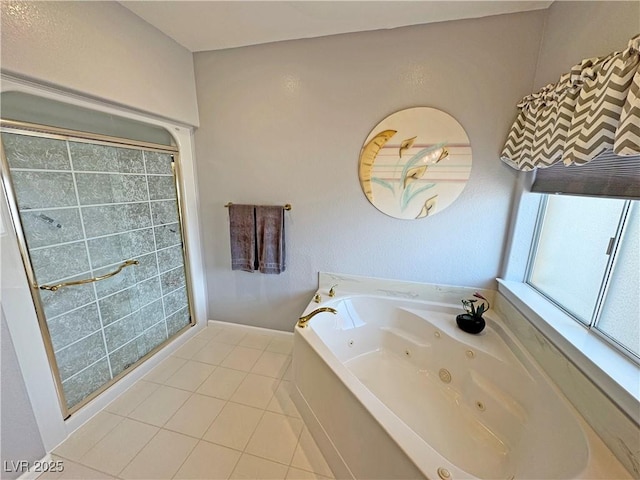 bathroom featuring tile patterned flooring and a jetted tub