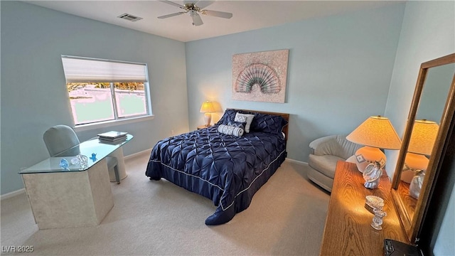 carpeted bedroom with baseboards, visible vents, and ceiling fan