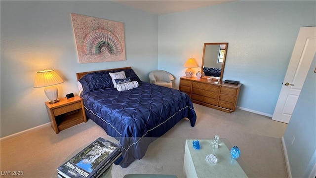 bedroom featuring baseboards and carpet flooring