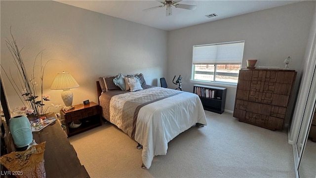 bedroom with light carpet, ceiling fan, and visible vents