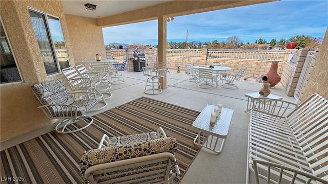 view of patio / terrace with outdoor dining area and grilling area