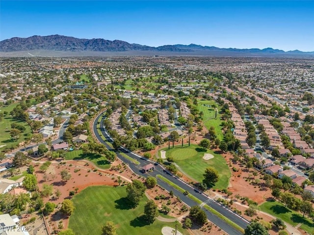 aerial view featuring view of golf course, a residential view, and a mountain view