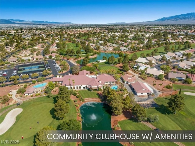 aerial view with a residential view, view of golf course, and a water and mountain view