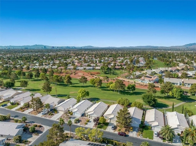 birds eye view of property featuring a residential view, a mountain view, and golf course view