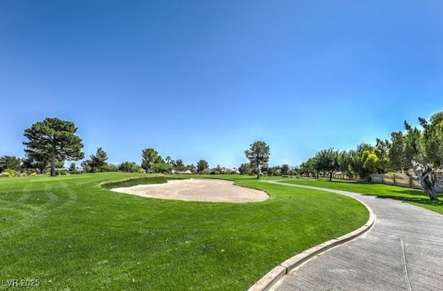 view of home's community featuring a lawn