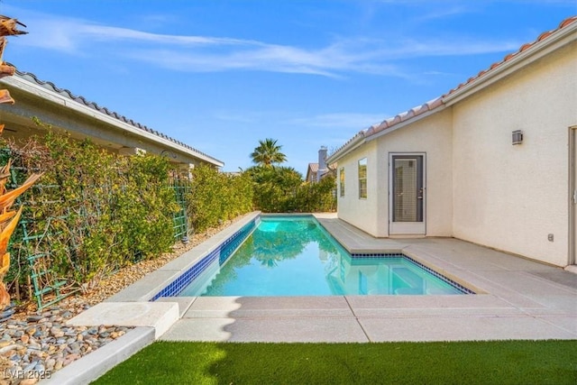 view of pool featuring a fenced in pool and a patio