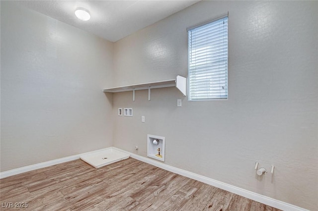 washroom featuring hookup for a washing machine, gas dryer hookup, wood finished floors, laundry area, and baseboards