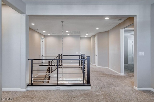 spare room with baseboards, carpet floors, visible vents, and recessed lighting