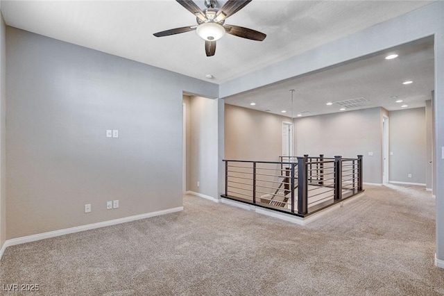 carpeted empty room with recessed lighting and baseboards