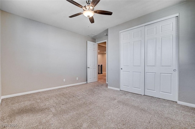 unfurnished bedroom with visible vents, a ceiling fan, baseboards, a closet, and carpet