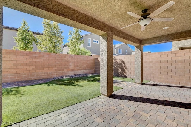 view of patio / terrace with ceiling fan and a fenced backyard