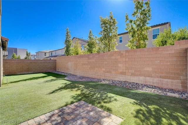 view of yard featuring a fenced backyard