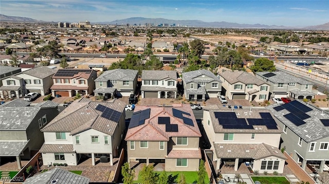 drone / aerial view with a residential view and a mountain view