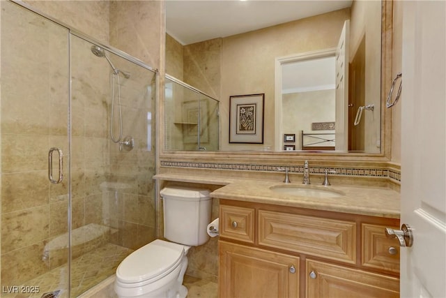 bathroom with tasteful backsplash, a stall shower, vanity, and toilet