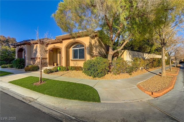 mediterranean / spanish house with stucco siding