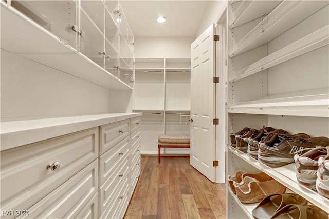 walk in closet featuring light wood-style floors