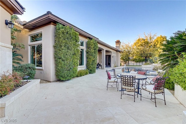 view of patio with outdoor dining area