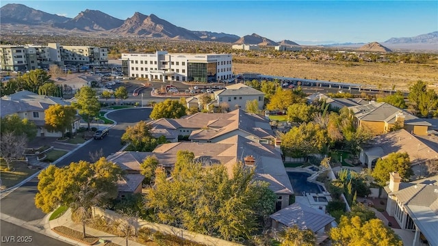 birds eye view of property featuring a mountain view