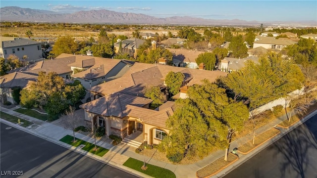 drone / aerial view with a residential view and a mountain view