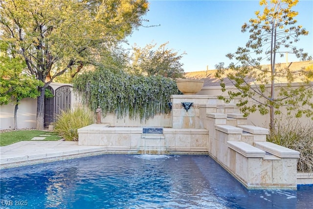 view of swimming pool with fence and a fenced in pool