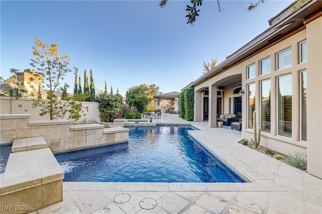 outdoor pool featuring a patio