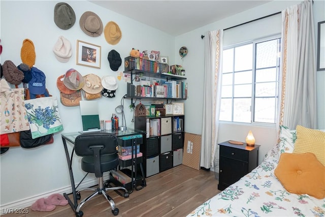 bedroom with wood finished floors