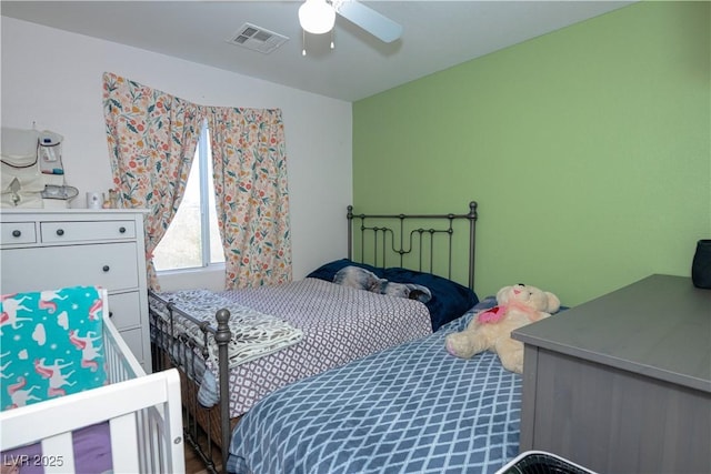 bedroom with ceiling fan and visible vents