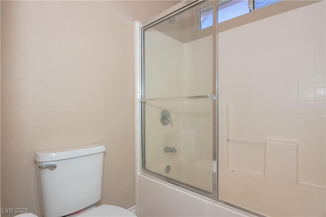 full bathroom featuring enclosed tub / shower combo and toilet