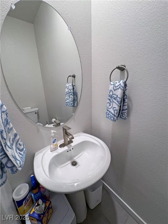 bathroom with a textured wall