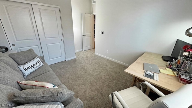 office space featuring baseboards and carpet