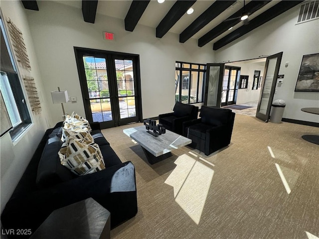 living room featuring visible vents, french doors, carpet floors, high vaulted ceiling, and beam ceiling