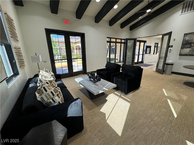 living area featuring carpet flooring, high vaulted ceiling, visible vents, beam ceiling, and french doors