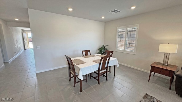 dining room featuring baseboards, visible vents, and recessed lighting