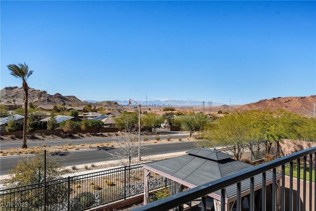 balcony featuring a mountain view