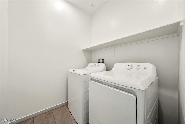 laundry area featuring laundry area, washer and clothes dryer, and baseboards