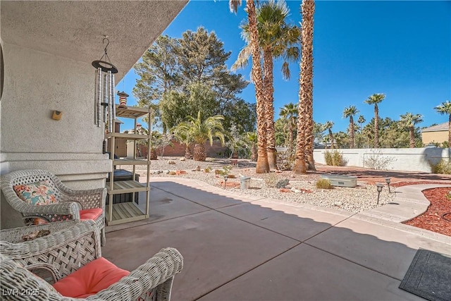 view of patio featuring fence