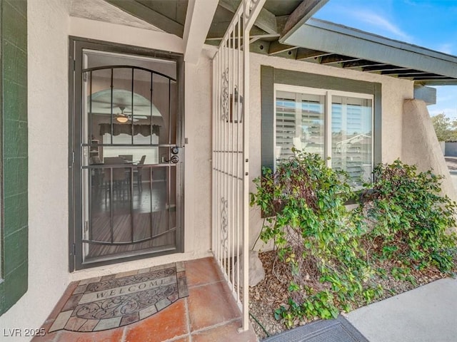 entrance to property with stucco siding