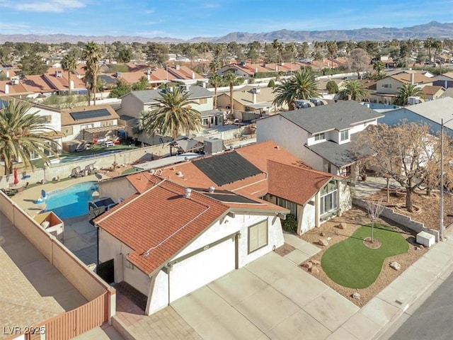 birds eye view of property with a residential view and a mountain view