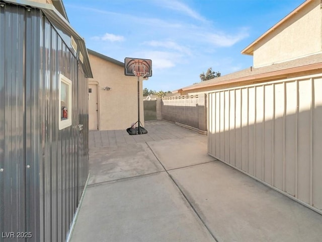 view of patio featuring fence